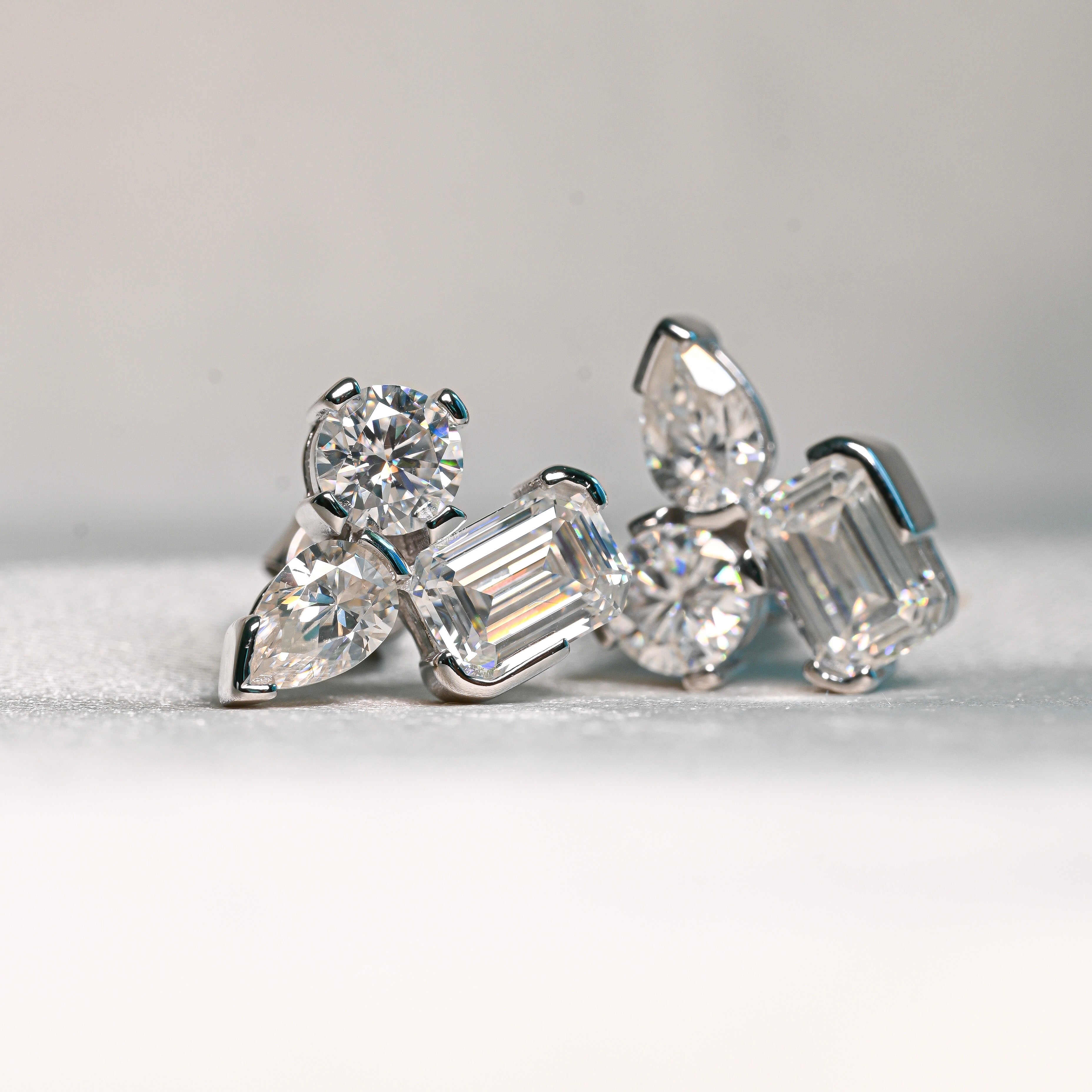 TAYLOR Moissanite Stud Earrings – 1 Carat Emerald Cut, 0.5 Carat Pear Cut & 0.5 Carat Round Cut