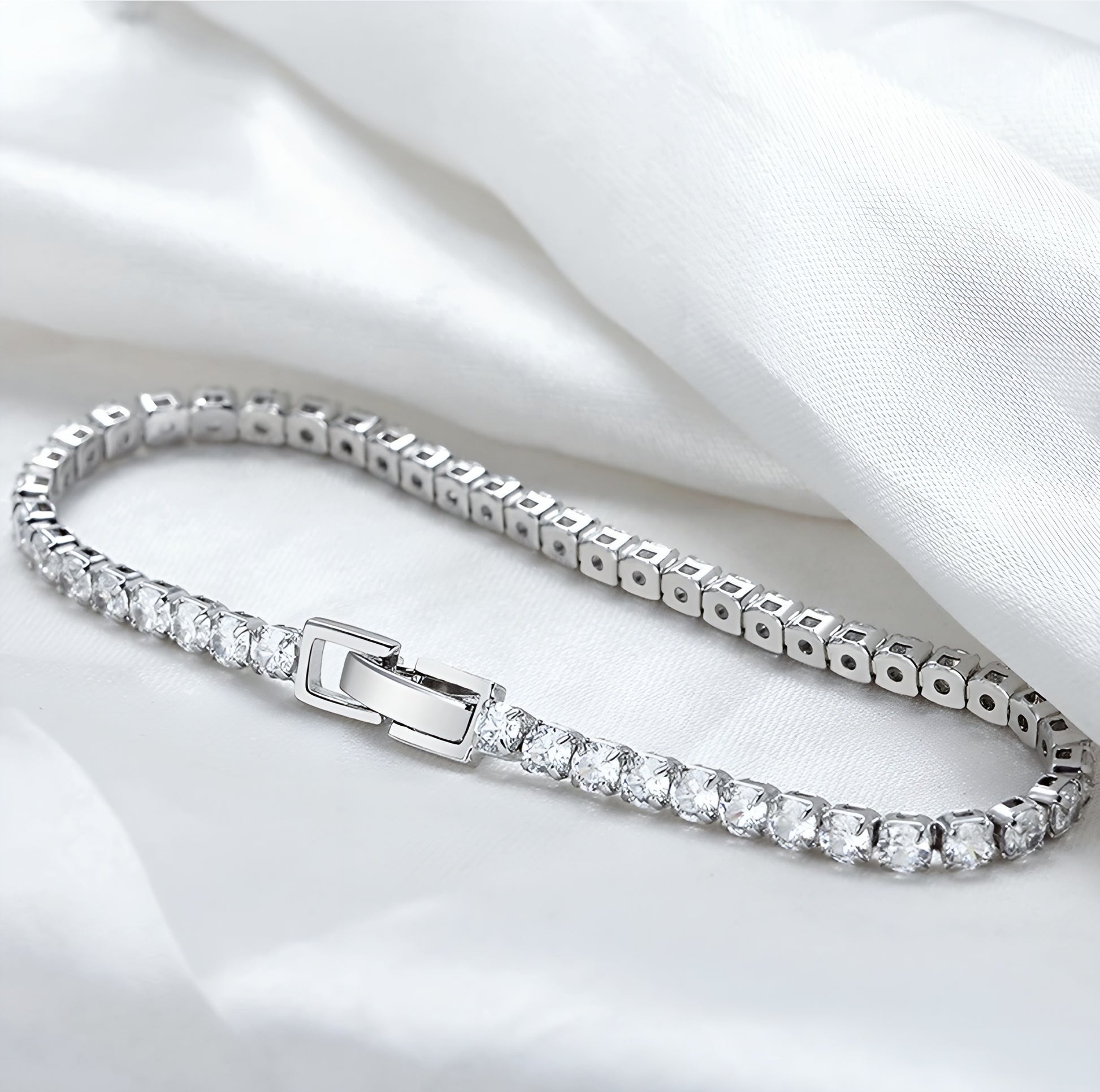 Cut Ice shaped simulated diamond bracelet in white stone, crafted in sterling silver plated with 18k white gold with rhodium, front side, main stone size 3mm