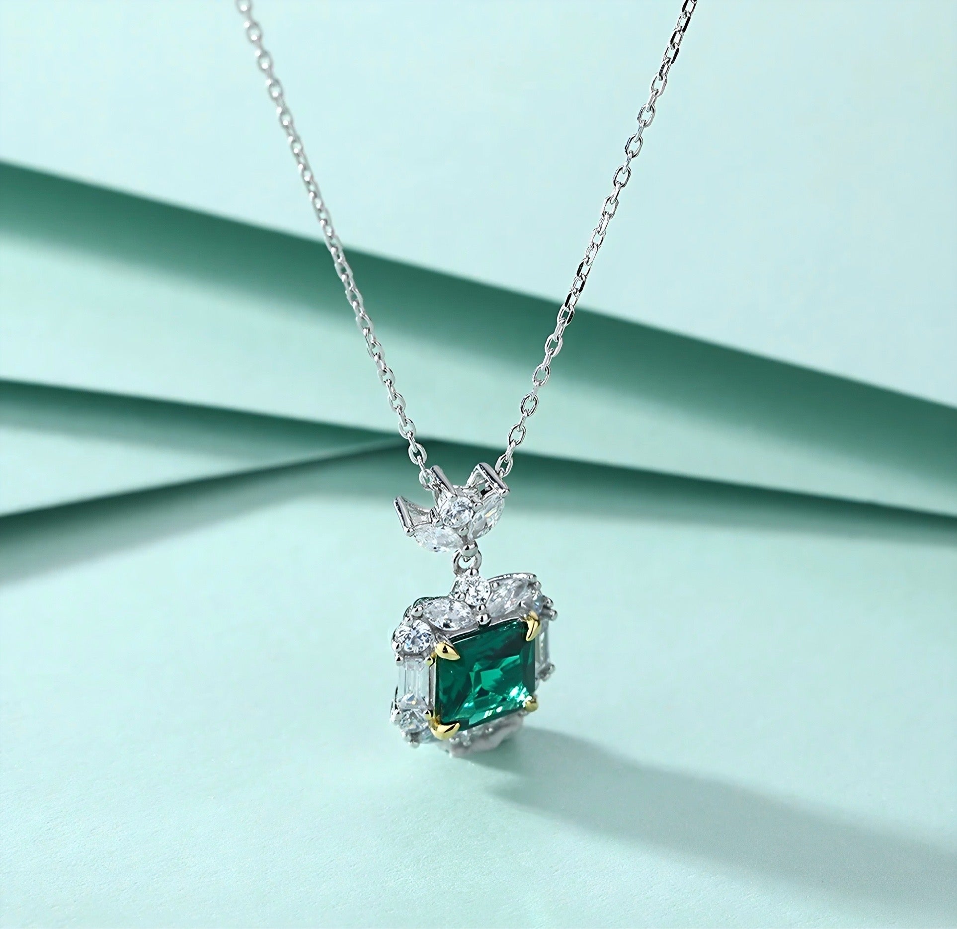 Esmeralda simulated diamond necklace in green color, crafted in sterling silver plated with 18k white gold with rhodium, side along, details of necklace